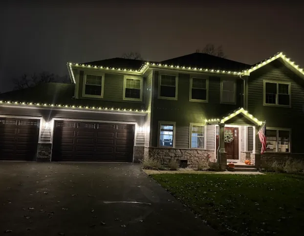 Dark-sided home with crisp warm white roofline lights